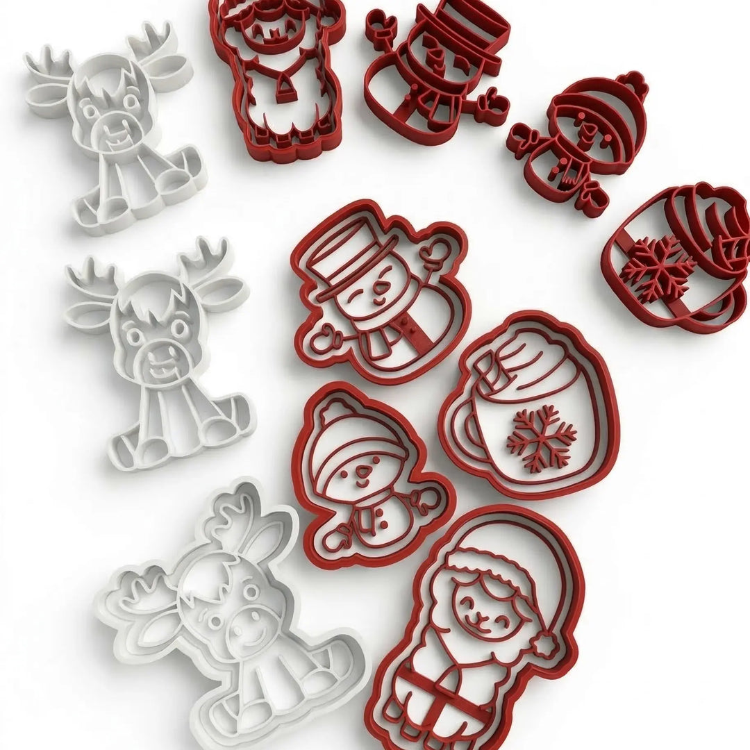 Set de cortadores de galletas navideños en color blanco y rojo con diseños de reno, Papá Noel y muñeco de nieve.