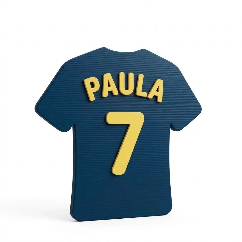 Placa de puerta infantil Camiseta con el nombre Paula, fijada con adhesivo por detrás